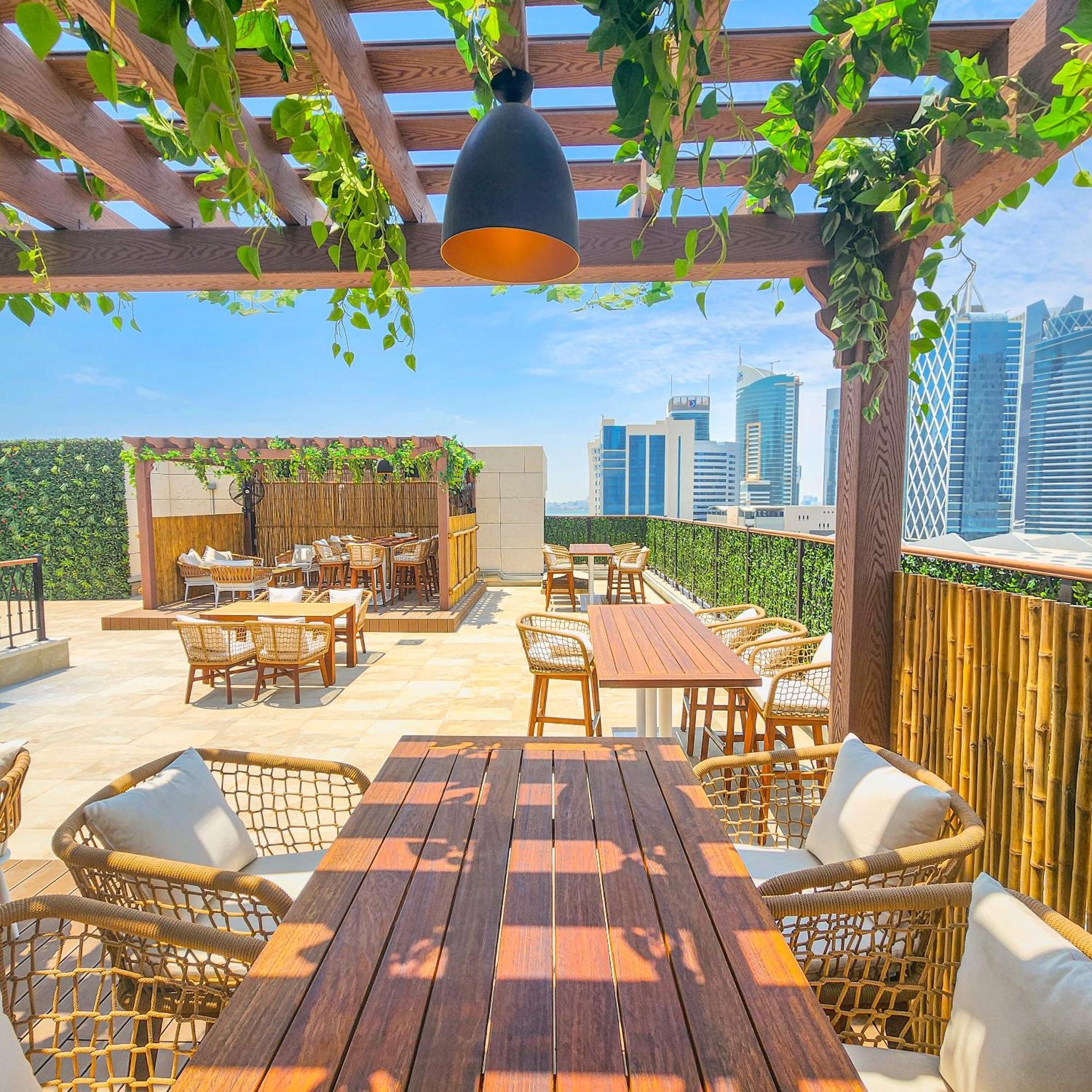 City Centre Rotana Doha Exterior foto The rooftop bar at the hotel